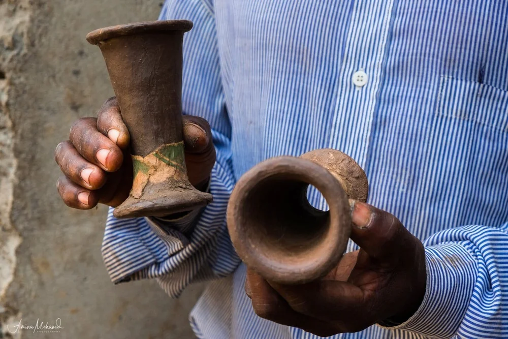 Hands of the artist who makes pottery in Rwenzori Mountains @Amina Mohamed Photography